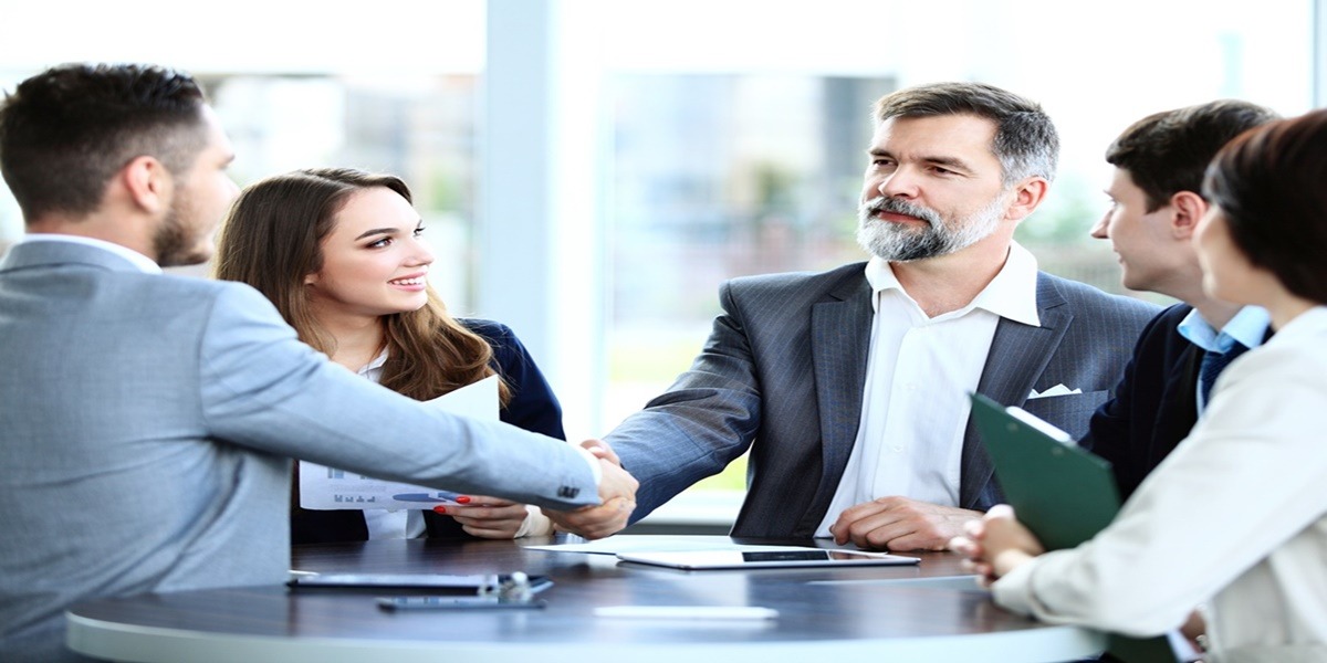 Business people shaking hands, finishing up a meeting